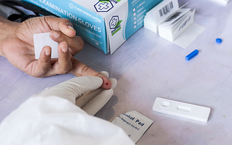 Health worker taking a blood sample from a suspected patient of corona virus during the mass testing.Health workers conduct rapid examinations for the corona virus in Pondok Betung, South Tangerang, to combat the spread of the covid-19 disease.