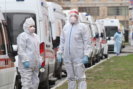 Medical workers wearing protective suits stand next to an Ambulance at the entrance to Pokrovksaya Hospital in Vasilyevsky island where patients with COVID-19 are treated.
At least 93 558 confirmed cases and 867 death by the corona virus disease have been recorded in Russia.