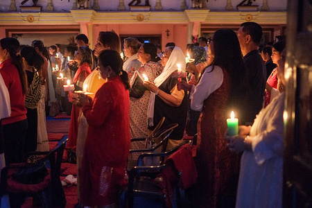 Catholic Christians hold candles during the Easter Vigil at a Church as part of the Easter celebration. Easter Vigil is a waiting process of the resurrection of Jesus Christ as a symbol of a new spirit for Catholics thanks to the light of Christ.