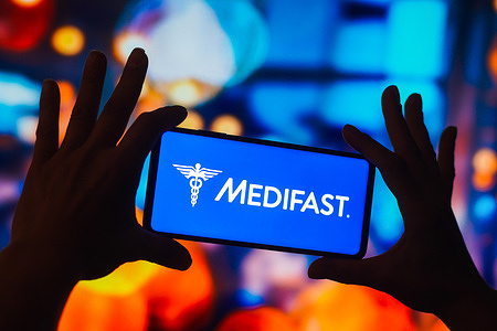In this photo illustration, the Medifast logo is displayed on a smartphone screen.