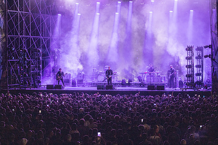 Members of the American post-punk revival band Interpol perform on stage during their headline concert. American post-punk revival band Interpol, headlining the Sequoie Music Park summer festival at the Parco delle Caserme Rosse in Bologna. The New York group revisited their career highlights in front of thousands of fans.