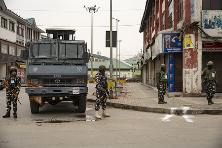 Indian security forces stand guard next to an armored vehicle at Lal Chowk during the Republic Day celebrations in Srinagar. The 77th Republic Day was celebrated across Kashmir amid tight security arrangements. Republic Day is a national holiday in India that marks the adoption of the Constitution of India and the country’s transition into a republic, which came into effect on 26 January 1950.
