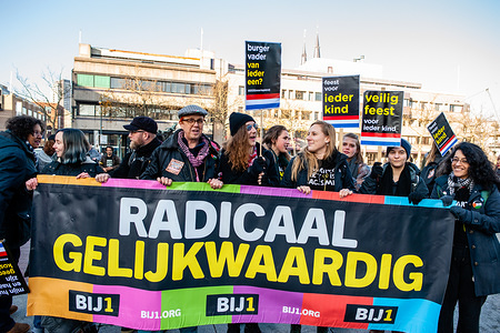 KOZP activists hold a big banner and placards
The Anti-Zwarte Piet group Kick out Zwarte Piet (KOZP) organized a rally against Sinterklaas’ black-faced helpers, in Eindhoven. The group feels that the traditional form of Zwarte Piet (Black Piet) is a racist caricature. Also, during the last weeks, some of them have suffered verbal and physical racist attacks. In Eindhoven, around fifty people gathered to speak out against racism and violence from radicalized pro-Zwarte Piet groups.