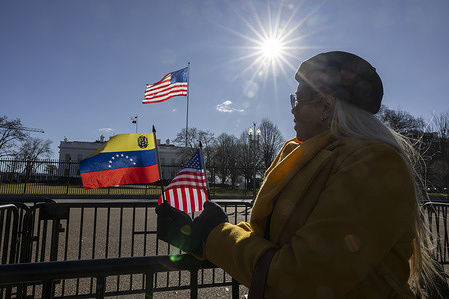 Supporters of Venezuelan opposition leader María Corina Machado gather outside the White House as Machado meets with U.S. President Donald Trump. Machado has publicly expressed support for Edmundo González, the Democratic Unitary Platform candidate, in the aftermath of the contested 2024 Venezuelan election.