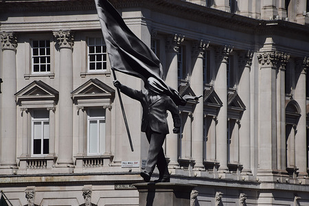 The new Banksy statue, depicting a man holding a flag which covers his face, is seen in Waterloo Place in Central London. The elusive street artist has now confirmed that he created the artwork.