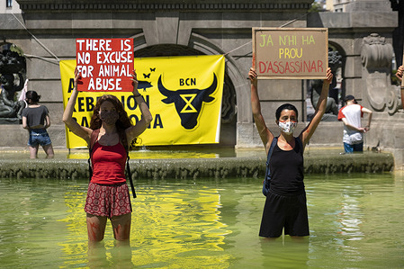 Protesters hold placards during the demonstration.
Animal Rebellion supporters carried out a protest action under the slogan Blood On Your Hands to point out animal suffering and environmental effects from the meat industry.