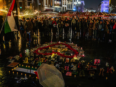 People seen surrounding the Palestinian display. People gathered around a memorial to honor the death of Hind Rajab and all other children killed two years ago during Israeli attacks in Gaza. Five-year-old Hind Rajab and her family were killed during an Israeli army attack in the Tel al-Hawa area of Gaza in January 2024.