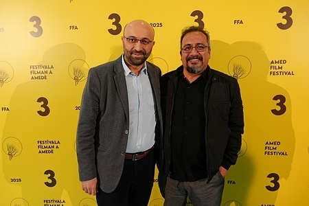 Ozkan Kucuk (L) and famous Kurdish stand-up comedian Murat Batgi attend the screening of the film Rojbash at the 3rd Amed International Film Festival in Diyarbakir.