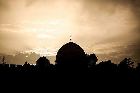 The Dome of the Rock mosque and the Old City in the background are seen during sunset.