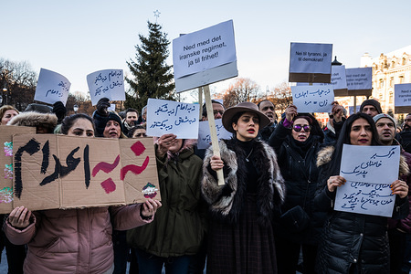 Protesters seen outside the Norwegian parliament. They are condemning the killings and crackdown of protesters by the Iranian clerical regime of President Rouhani and Supreme leader Ayatollah Ali Khamenei.