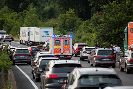 Cars create a "corridor of life" enabling emergency services to reach the scene of an accident on Bundesautobahn 7 in Norten-Hardenberg.