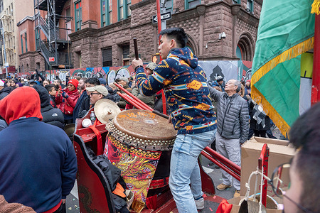 A Chinese drummer performs a Chinese traditional drumming during the celebration for the Lunar New Year of the Rabbit in Chinatown, New York City.