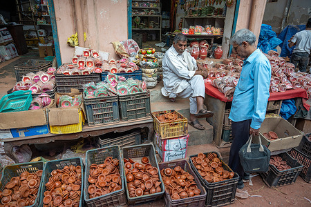 A man buys decorative diyas ahead of the Diwali festival at a wholesale diya and idol market in New Delhi. As the Diwali festival approaches, markets across the capital are glowing with colorful clay diyas and beautifully crafted goddess idols. Potters and artisans are busy shaping and painting traditional clay diyas and idols, which symbolize light, faith, and festivity. Shoppers are flocking to these markets to buy the handmade diyas and idols to decorate their homes and places of worship.