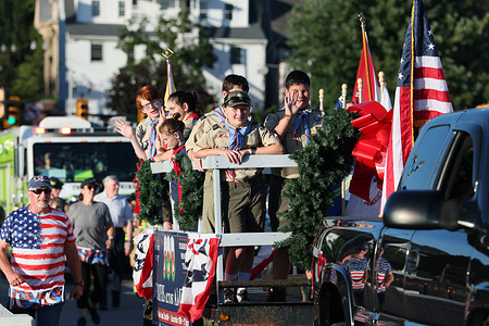 Boy Scouts participate during a parade to commemorate the 25th anniversary of the September 11th terrorist attacks.