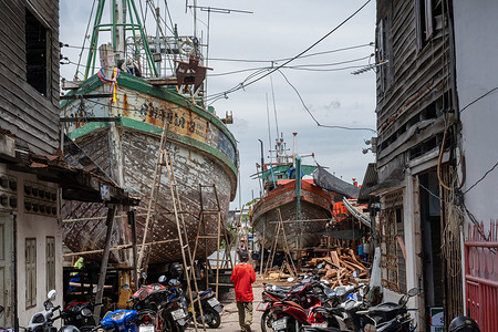 Traditional wooden fishing boats seen under construction in the boatyard. For generations, local craftsmen have built and repaired vessels that support the region's fishing industry and coastal communities. Despite modernisation and economic pressures, these workshops remain an important part of the area's maritime heritage and local economy.