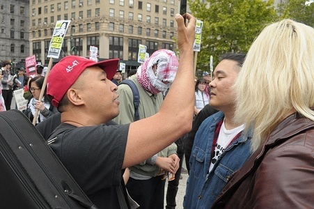 A counter-protester wearing a "Make America Great Again" hat, (L), speaks with demonstrators who are supporting Yunseo Chung at a rally in Foley Square outside of the courthouse where Chung's deportation trial is taking place. Demonstrators in Manhattan condemned the Trump administration for planning to deport Yunseo Chung, a U.S. legal permanent resident from South Korea. On Thursday, Chung had a court hearing in New York City to challenge her deportation case. Chung, a Columbia University student, was arrested and given a citation, not held in jail, following her participation in a March 5 protest opposing Columbia University for targeting pro-Palestine student protesters on campus. She claims U.S. Immigration and Customs Enforcement, ICE, has been trying to arrest and deport her following her March 5 arrest.