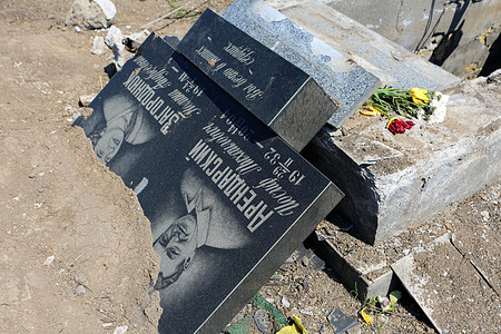 A destroyed gravestone during the Russia-Ukraine war. Russian shelling of Odessa, rockets hit Novo-Gorodskoe cemetery (or Tairovsky Cemetery). Destroyed more than 1000 square meters of the cemetery. Russia invaded Ukraine on 24 February 2022, triggering the largest military attack in Europe since World War II.