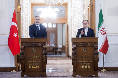 Iranian Foreign Minister Abbas Araghchi and Turkish Foreign Minister Hakan Fidan seen during their joint press conference.