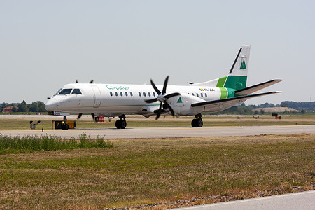 A Carpatair SAAB 2000 waiting at holding point at Bologna airport.