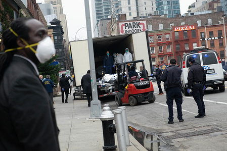 NEW YORK, UNITED STATES - MARCH 31, 2020: The body of a deceased covid-19 patient is loaded into a temporary morgue outside of the Brooklyn Hospital amid the coronavirus outbreak.
The state of New York has turned into the epicenter of the COVID-19 coronavirus in the United States with over 75,000 confirmed cases and 1,500+ deaths reported.
