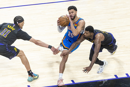 Oklahoma City Thunder’s Ajay Mitchell (25) drives between Los Angeles Lakers’ Jaxson Hayes (11) and Marcus Smart (36) during Game 4 of a second-round NBA playoff series at Crypto.com Arena on Monday, May 11, 2026 in Los Angeles.