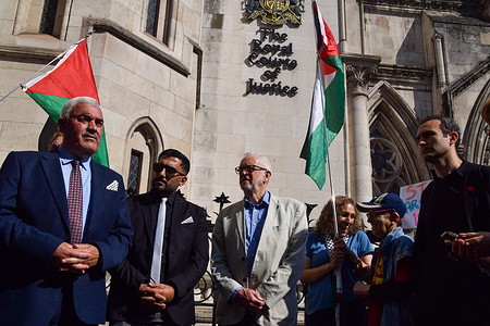 Former Labour leader Jeremy Corbyn (C), actor and activist Khalid Abdalla (R) and General Director of Al-Haq Shawan Jabarin (L) stand outside the Royal Courts of Justice during the legal challenge against the UK government over ongoing licensing of arms exports to Israel. The campaigners say that the weapons are linked to potential war crimes against Palestinians in Gaza.