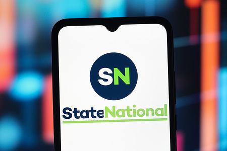 In this photo illustration, the State National Insurance (SN) logo is seen displayed on a smartphone screen.