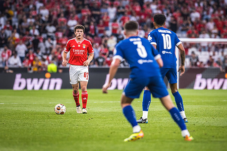 Joao Neves of SL Benfica (L) with Pierre-Emerick Aubameyang (R) and Quentin Merlin (C) of Olympique de Marseille in action during the UEFA Europa League quarterfinal first leg match between SL Benfica and Olympique de Marseille at Estadio da Luz in Lisbon. (Final score: SL Benfica 2 - 1 Olympique de Marseille)