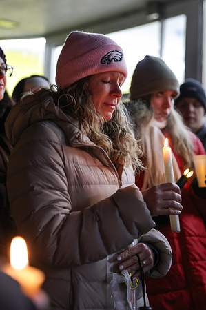 A woman holds a candle during a vigil for Danville business owner Sergio Chavez Jimenez who was taken into custody by U.S. Immigration and Customs Enforcement (ICE).