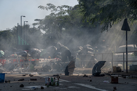 Tear gas being fired at protesters during the demonstration.
A general strike organised by protesters turned into clashes and conflicts, the riot police tries to secure the second bridge in the Chinese University of Hong Kong.