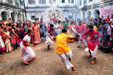 Hindu devotees seen dancing with Dhunachi (Indian incense burner) next to an idol of Devi Durga during the Vijaya Dashami celebration. Vijaya Dashami is the last day of the 10 days long Durgapuja Festival in India.