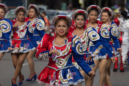 Group of Saya folkloric dancers during a festival showcasing pre-Hispanic cultures. Migrant movements from each Latin American country were also involved and the Argentine feminist movement and numerous associations of indigenous migrants in Spain such as Quechua, Aymara, Changos, etc.