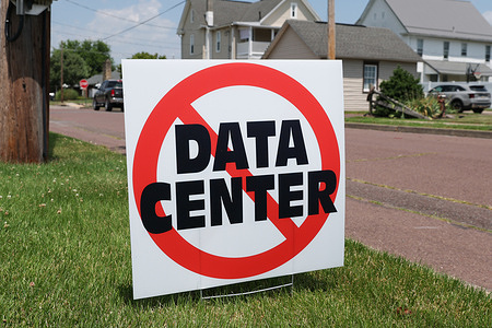 A yard sign expressing opposition to allowing data center construction is seen outside of a home in Nescopeck.
