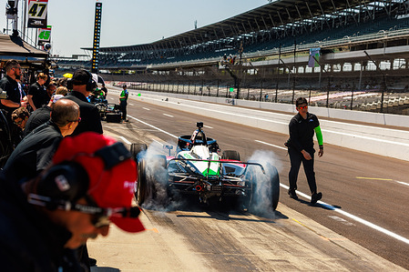 IndyCar driver Takuma Sato (75) practices for the Indy 500 at the Indianapolis Motor Speedway. The practice for the race is part of the schedule leading into the Indianapolis 500.