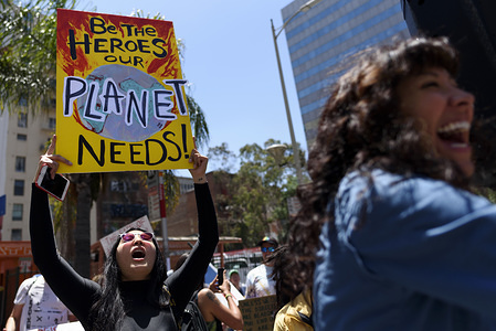 A protester during a climate change demonstration holds a placard that says Be The Heroes Our Planet Needs.
Students and environmental activists participate in a Climate Strike in Los Angeles, California. Organizers called on the Trump Administration to declare a state of climate emergency in order to save the planet, create a Green New Deal and transition into a zero emissions economy.