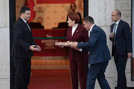 DP Chairman Gültekin Uysal (L) receives a gift from Iyi Party Chairman Meral Akşener (R) at a meeting to plan about what will happen after the election to be held in Turkey in 2023. The CHP - Republican People's Party, SP - Felicity Party, DEVA - Democracy and Progress Party, DP - Democratic Party, İyi - Good Party and GP - Future Party made an alliance against the AK (Justice and Development) Party in the elections.