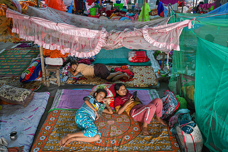 Girls take rest at a relief camp in Imphal. The genesis of the conflict in Manipur lies in the ethnic fault lines that have reportedly displaced over 60,000 people from their homes and placed most of them in 350 camps.