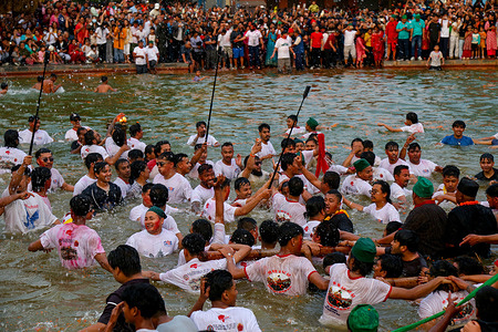 Nepalese devotees carry a chariot of Hindu goddess Tudaldevi into the pond during Gahana Khojne Jatra or festival to search for lost jewellery. It is believed that, goddess Tudaldevi lost her jewelry while she was taking a bath in the pond so every year devotees gather and carry her chariot to help her find her lost jewellery.