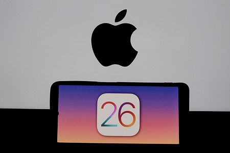 In this photo illustration, the Apple iOS 26 logo is seen displayed on a smartphone screen.