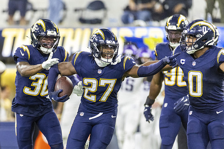 Los Angeles Chargers safety RJ Mickens #27 celebrates after scoring an interception against the Minnesota Vikings during an NFL football game at SoFi Stadium. Final score; Los Angeles Chargers 37:10 Minnesota Vikings