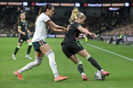 Nina Nicosia (L) of Mexico women football team and Kaitlyn Torpey (R) of Australia women football team seen in action during the women's international friendly match between Australia and Mexico held at Commbank Stadium. Final score; Australia 3:1 Mexico.