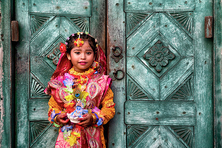 A child dressed as Goddess Shri Radha poses for a photo during the Janmastami festival celebration. Janmashtami festival is an annual Hindu festival that celebrates the birth of Krishna - the incarnation of Vishnu as per Hindu mythology.