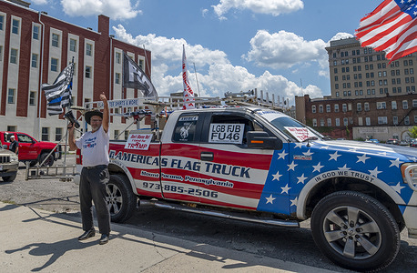Larry LoSchiavo holds a bullhorn calling for anyone that voted for Biden to step up as he stands in front of his truck, he was planning to welcome President Joe Biden to Wilkes-Barre before he spoke at Wilkes University but Biden tested positive for Covid-19 before the event.