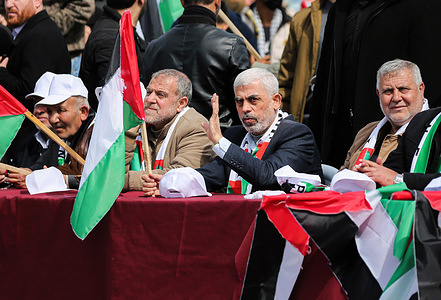Yahya al-Sinwar (R2), head of Hamas in the Gaza Strip seen during a rally to commemorate the 46th Palestinian Land Day anniversary at the seaport in Gaza City. Land Day marks an incident in 1976 when Israeli troops shot and killed six people during protests against land confiscations.