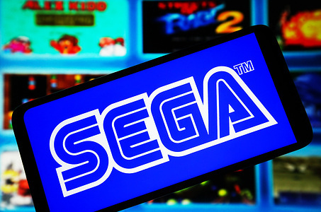 In this photo illustration, Sega Corporation logo is seen on a smartphone screen.