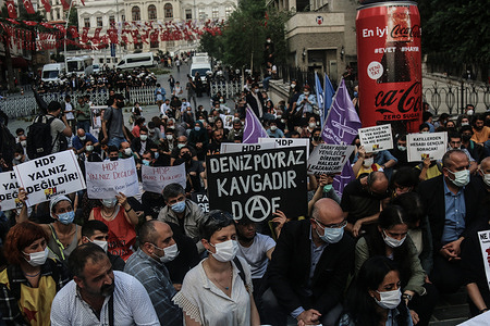 Protesters hold placards during a demonstration.
People held a protest against Armed Attack on Peoples' Democratic Party Izmir Office, the armed attacker Onur Gencer, who came to the headquarters of the pro-Kurdish Peoples' Democratic Party in Izmir at around 11:00 am today, killed a 40-year-old employee Deniz Poyraz. The gunman, who randomly shot around with a gun, was later caught by the police and taken into custody. In his first statement, the attacker said that he carried out the attack because he hated the Kurdistan Workers Party and that he planned to kill more people.