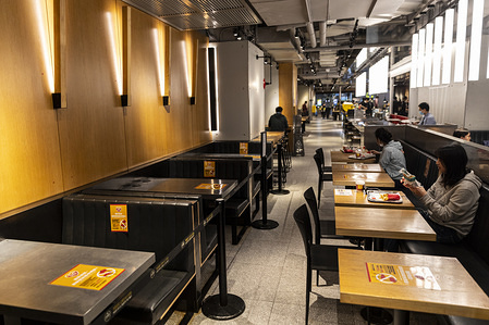 Customers seat at a social distance in a restaurant during the corona virus pandemic.
The Hong Kong government has imposed new restrictions in form of a social distance law as a preventive measure against the spread of Coronavirus, officially known as Covid-19.