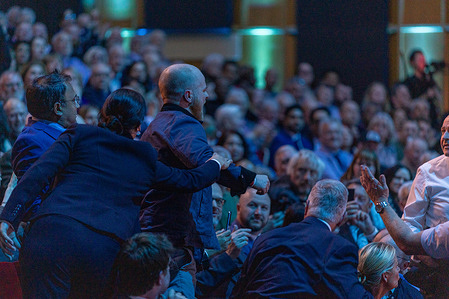 A protestor interrupts and is ejected as Reform UK party leader, Nigel Farage speaks at the Reform UK Rally at Fairfield Halls.