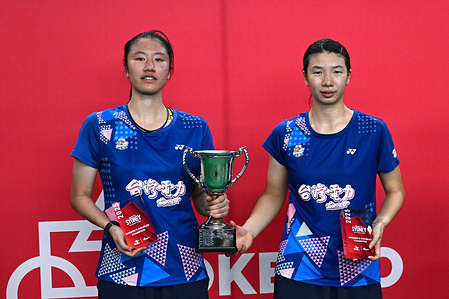Hsieh Yi En (L) and Chen Su Yu (R) of Chinese Taipei pose for a photo with the Women's Double trophy during the ROKETTO Sydney International held at ROKETTO Badminton Centre.