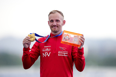 Mads Brandt Pedersen from Denmark wins a gold medal in the Men's K1 Long Distance Final in the Canoe Marathon of the 2025 World Games at the Xinglong Lake Hubin Arena.
